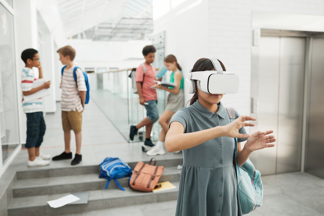 gallery-5 Group of students exploring virtual reality technology at a modern school setting.
